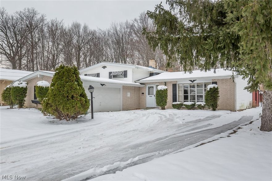 Spacious Mayfield Heights split in neighborhood of higher priced homes in convenient and quiet location. 3br, 2 ba. fr. etc...This one will need a bit of cosmetic work to bring it up to snuff, but is a good value for the price.  Furnace and a/c were replaced in 2017 and the roof is just three years old so already you're off to a great start.  Formal dining room and private patio look out over the wooded back yard.