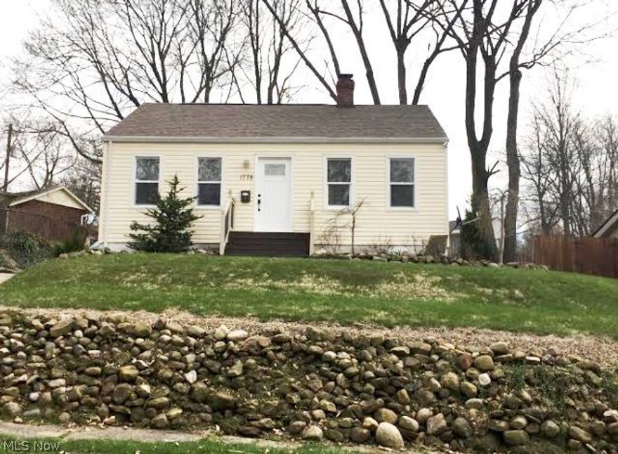 Completely updated & beautifully appointed 2BR contemporary bungalow complete with top dollar finishes throughout. The spacious living room offers elegant frizee carpet & opens to the gourmet eat-in kitchen with stainless appliances, sleek concrete countertops, unique tile backsplash, beautiful dark wood cabinets/hardwood floors. Two nice sized bedrooms flank the exquisite, upgraded full bathroom. The fully finished lower level offers a large theater room/additional living area with tile flooring & an adjacent laundry/utility room. Additional features/updates include: a newer back deck (recently stained), a charming backyard w/green space,  10x12 barn for storage, newer windows/roof, newer high efficiency furnace & A/C, hot water tank, newer carpeting & added insulation in attic.