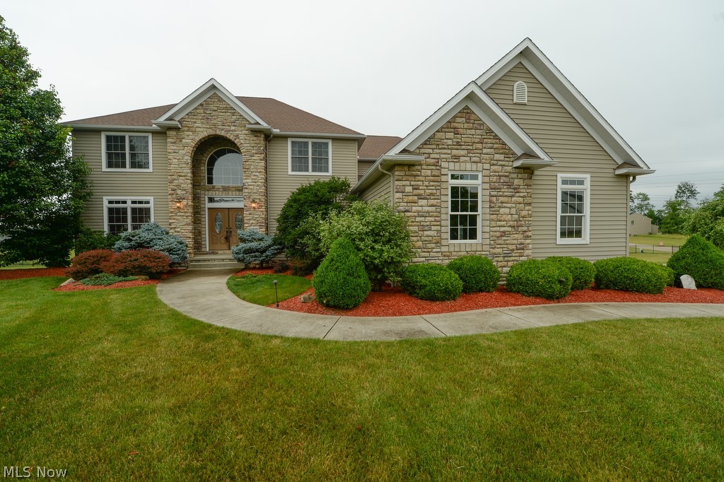 Rare true 5 Bedroom home! 1st Flr Bdrm w/ attached bath & 2nd Floor Owners Retreat w/ Sitting Room & Master Bath & 3 walkin closets, 4.5 Bathrms, 3+ Garage, almost an acre parcel (2 combined lots) w/ Walk Out Lower Level: Media Rm, Family Rm, 2nd Kitchen, Full Bath & Exercise Room in Sugar Maple Hills close to KSU. 3,688 sq ft on main 2 levels PLUS 1,800 sq ft walkout finished Lower Level provides about 5,500 sq ft of living space in this beautiful custom built home, great for multigenerational or larger families or in home business. Amenities: 2-story Great Rm w/ 18' wall of windows overlooking yard, pond & walking trails, corner fireplace; wood & iron spindled walkway & staircase overlook Grt Rm & 2-story foyer flanked by large Dining Rm w/ Butler Pantries & cgerry Home Office w/ built-in bookcases & cabinetry! Gorgeous kitchen w/ large seating island, beautiful granite, high-end cherry cabinetry, stainless steel GE chef appliances w/ 36" gas cooktop, convection oven, hood vent, dish