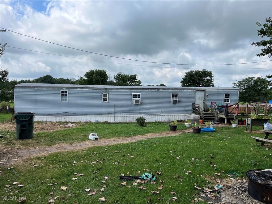 2 acres in Northwestern Schools with a 3 bedroom mobile home. Property will be sold as-is where-is. There is a fenced area in the rear with lots of extra yard space.