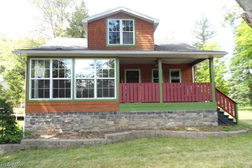 This is a truly one of a kind rustic style home situated on 1.3 acres! The current owner tore the house down to the studs (inside & out) and and completely rebuilt/redesigned to maximize every inch and add an additional 200+ sqft. The exterior features a mix of cedar, stone, wood, and vinyl for a look like nothing else in the area. New roof, gutters, siding, windows, electric, water softener, enclosed back porch, completely remolded bathrooms and more in the last 6 years!! Enjoy wood floors, stone accents, a den with coffered ceilings, and built-ins throughout. Stainless steel appliances and washer & dryer stay! The front of the home offers a huge open front porch for warm nights under the ceiling fan in your favorite rocking chair. The rear has a fantastic wood enclosed porch with high ceiling and fan, and natural gas line that runs to the porch and outside for your choice of spots for your natural gas grill. The 1.2 acres is a gardener's delight. There is a fenced garden, a small hot