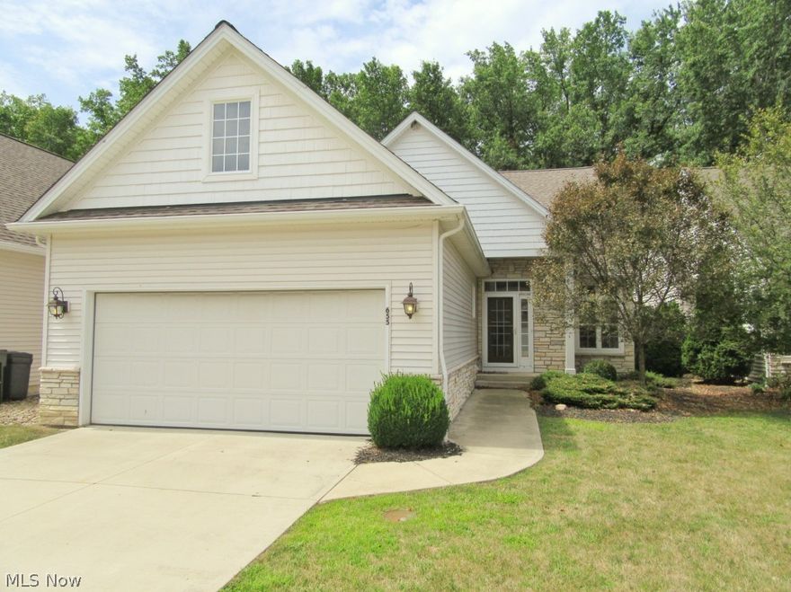 Spacious ranch with wooded views! Located just minutes from the Cuyahoga county line & centrally placed to points east & west.  Nice entry foyer w/ hardwoo opens to a dining room space or office with transom windows.  Spacious eat in kitchen with white cupboards & center island.  Striking great room with vaulted ceilings & corner fireplace overlooks wooded backyard space.  Spacious owner's suite w/ vaulted ceiling & private full bath.  Jack & Jill bath between bedrooms 2&3. First Floor Laundry.  Extra entertaining space in the partially finished basement! Enjoy the back patio overlooking wooded space!