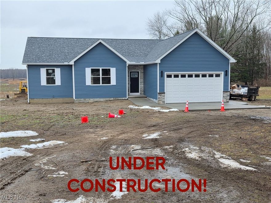 Welcome to the rare opportunity of owning a brand-new home tailored for comfort, style, and efficiency- all set on 2.37 scenic acres. This thoughtfully designed ranch blends modern construction with timeless ease of one-floor living. Imagine arriving home to your private retreat, tucked 200 feet off the road for peace and quiet, yet close to Lake Erie, charming wineries, and abundant wildlife. Step inside and be captivated by soaring 14-foot vaulted ceilings, an open-concept living, dining, and kitchen area, and elegant French doors that open to a covered back deck. This inviting outdoor space is finished with a custom-designed floor-perfect for morning coffee, summer entertaining, or relaxing while you take in the peaceful surroundings. The heart of the home features custom cabinetry and quartz counters, while luxury vinyl plank flooring flows seamlessly throughout. Your master suite is a sanctuary, with a walk-in closet and spa-inspired bath complete with a tiled walk-in shower, rain head, and body jets. Designed with energy efficiency in mind, this home offers superior insulation, an on-demand hot water tank, a gas furnace with central air, and an insulated garage door to keep you comfortable year-round. The attached two-car garage with epoxy finish adds both function and style, while the 6-course concrete crawl space offers generous storage. From the custom finishes to the thoughtful layout, every detail has been considered to create a home that feels both beautiful and practical. This is more than a home-it's a lifestyle. New construction. Energy efficiency. Privacy. Convenience. The perfect backdrop to live, relax, and enjoy.