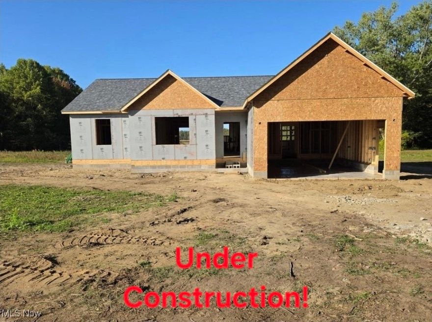 Welcome to the rare opportunity of owning a brand-new home tailored for comfort, style, and efficiency- all set on 2.37 scenic acres. This thoughtfully designed ranch blends modern construction with timeless ease of one-floor living. Imagine arriving home to your private retreat, tucked 200 feet off the road for peace and quiet, yet close to Lake Erie, charming wineries, and abundant wildlife. Step inside and be captivated by soaring 14-foot vaulted ceilings, an open-concept living, dining, and kitchen area, and elegant French doors that open to a covered back deck. This inviting outdoor space is finished with a custom-designed floor-perfect for morning coffee, summer entertaining, or relaxing while you take in the peaceful surroundings. The heart of the home features custom cabinetry and quartz counters, while luxury vinyl plank flooring flows seamlessly throughout. Your master suite is a sanctuary, with a walk-in closet and spa-inspired bath complete with a tiled walk-in shower, rain head, and body jets. Designed with energy efficiency in mind, this home offers superior insulation, an on-demand hot water tank, a gas furnace with central air, and an insulated garage door to keep you comfortable year-round. The attached two-car garage with epoxy finish adds both function and style, while the 6-course concrete crawl space offers generous storage. From the custom finishes to the thoughtful layout, every detail has been considered to create a home that feels both beautiful and practical. This is more than a home-it's a lifestyle. New construction. Energy efficiency. Privacy. Convenience. The perfect backdrop to live, relax, and enjoy.