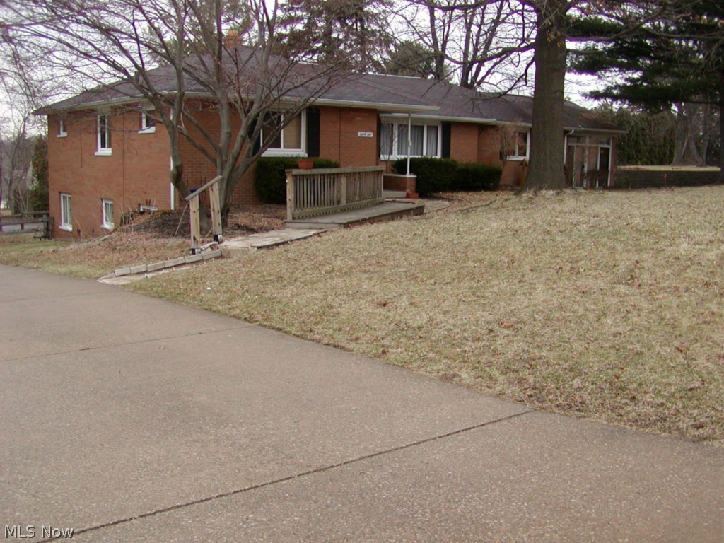 Lot 115 X 180.Don't miss this exceptional ranch with many extras to offer. 3 bedrooms on the main level plus a 4th bedroom in the walk-out basement level that boasts a full 2nd living area with a kitchen, living room & private bath for a mother-in-law or son or daughter who moves back in. Private entrance. A recreation area in the lower level next to the laundry room & another full shower bath. On the main level is a full bath, homemaker's dream applianced kitchen with granite counters & many cupboards. From the kitchen relax in the rustic family room with woodburning stove then enter your wonderful sun room with vaulted ceiling. Lots of storage. Square footage does not include the finished walk-out basement recreation room or the furnished mother-in-law area.