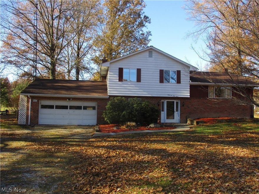 Large 3 level split, 4 bedrooms, 2 bathrooms and 2 car attached garage on 10 acres.  Includes 30 x 40 outbuilding.  Furnace is less than a year old.  1 year old hot water tank, new submersible well pump (less than a year old).  12 year old 30 year roof.  Wood burning fireplace in family room.  24 x 12 rear deck.  Southeast schools.