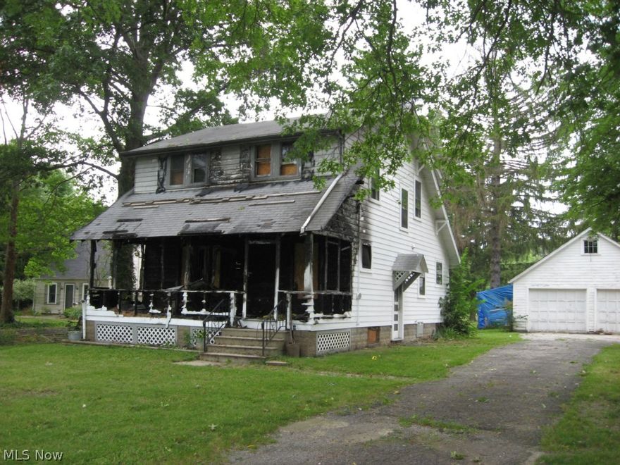 Truly a "Fire Sale". Home has serious fire damage, front porch and front wall burned.  Total renovation due to fire and smoke damage.  First floor bedroom, formal dining room, large eat-in kitchen, large living room.  Great, 1.49 acre lot with country location and atmosphere. City water. Currently septic but plans are in the works for the sewers to be installed along Cook Road in 2015.  Check with Olmsted Township for more information.  Over-sized two-car, detached garage.  Quick access to I-480 and Ohio Turnpike.  Owner says "SARO" - Submit All Reasonable Offers.