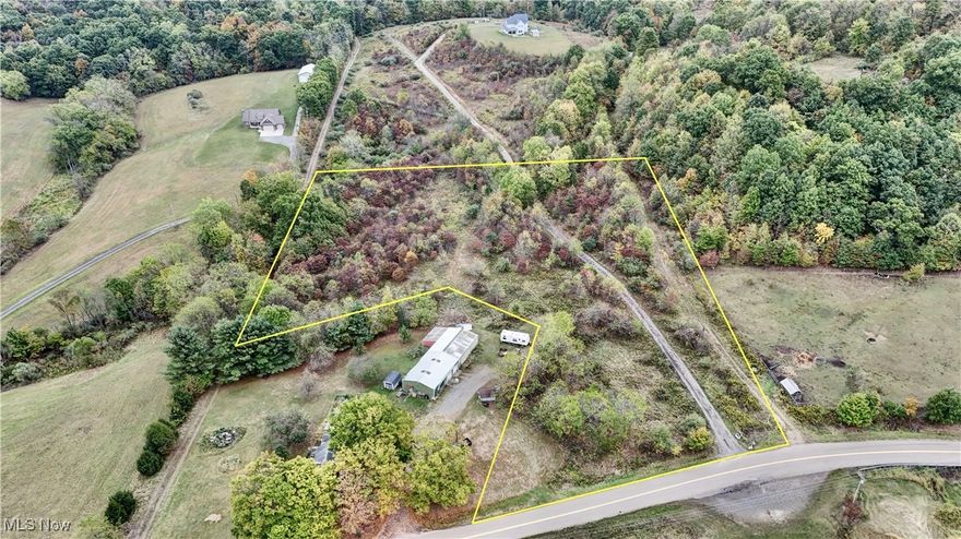 Discover the perfect blend of nature and opportunity with this stunning 5-acre property! Nestled in a serene, mostly wooded area, this land offers the ideal setting for your dream home or recreational retreat. Shared drive at property. Sellers will also transfer separate mineral deed.  Oil/Gas rights currently hbp. Feel free to walk at your convenience.