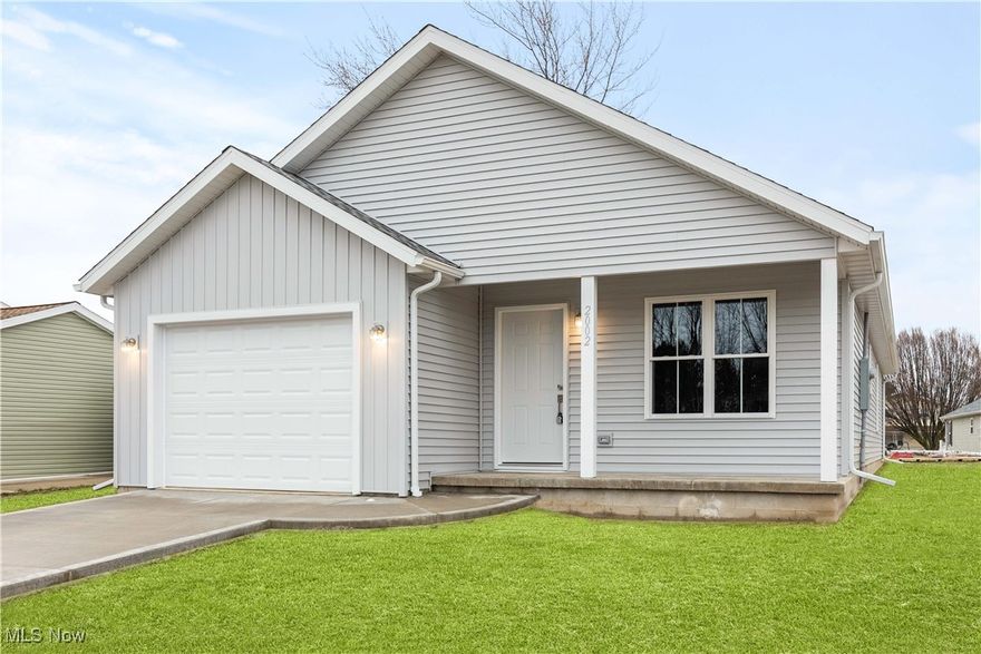 This stunning NEW CONSTRUCTION offers a unique blend of modern design and convenience. With a 10-year 75% tax abatement and potential grant opportunities, this home is a fantastic investment. The one-story layout features an open floor plan, a cozy fireplace in the great room, and a beautifully designed kitchen with granite countertops, stainless dishwasher and range, and a sleek wall-mounted range hood. The master suite is a true retreat, complete with a private full bath, double sinks, a large walk-in closet, and direct access to a covered back patio - the perfect spot to enjoy your morning coffee or unwind with a glass of wine. Additional highlights include an attached garage with a heated utility room and a welcoming covered front porch. Located just minutes from Cedar Point, Sports Force, and the beautiful shores of Lake Erie. Don't miss the opportunity to make this beautiful home yours! No HOA.