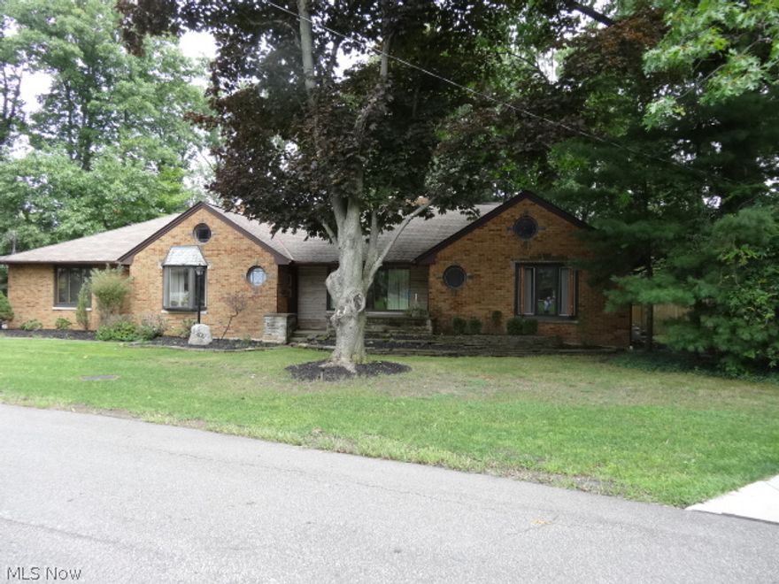 If you are looking for a beautiful back yard and a view that shows nature at its best, then this is the home for you. This 3 bedroom, 2 bath, all brick Ranch has that view. It sits on almost a 2 acre cul-de-sac wooded lot. Most of the windows are brand new. It has a newer roof and updated bathroom. The new kitchen comes with granite counter tops, and all Brand New Stainless Steel appliances. The eat in dinette has a wet bar that looks into the 26 x 25 Great Room with fire place and brand new Cherry floors. As you move outside from the Great room you will be on a covered patio and a multi-tier deck that has a screened gazebo and your private wooded lot. There a wine cellar in the crawl space. It comes with 2 furnaces & 2 air conditioners for zone heating and cooling. The hot tub and pool table are negotiable. This one is a Must see!