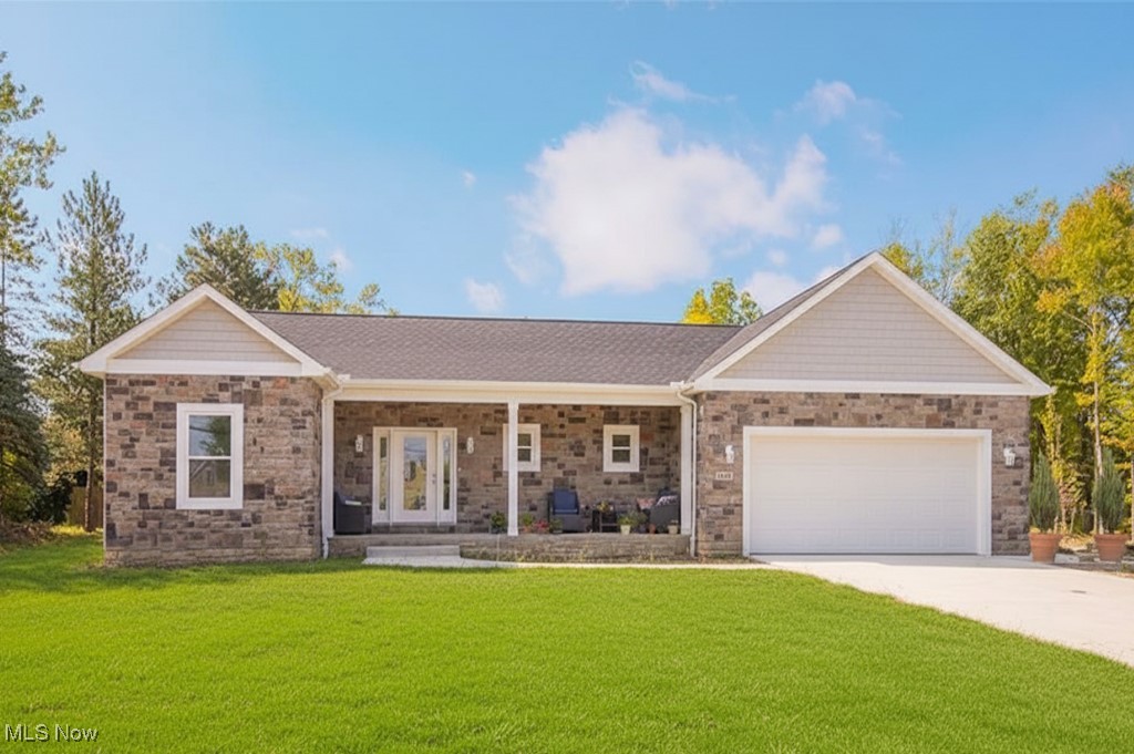 Welcome to this stunning new construction ranch home nestled in the heart of Strongsville! From the moment you arrive, you’ll be captivated by the covered front porch adorned with beautiful custom stonework, creating an inviting entrance that exudes charm. Step inside to discover a bright and airy open-concept design that seamlessly connects the living spaces. The heart of this home is the exquisite kitchen, featuring gorgeous white quartz countertops, a stylish backsplash, and a large center island perfect for gatherings. A dedicated coffee bar adds a delightful touch for your morning routine, while the spacious pantry ensures all your culinary essentials are neatly organized. Stainless steel appliances enhance the modern feel, making this kitchen a true chef's paradise. Natural light floods the family room, where a striking ceiling-to-floor tile fireplace serves as the focal point, offering warmth and elegance. This inviting space is perfect for entertaining or cozy family nights. The master bedroom is a serene retreat, boasting a generous closet and an en suite bathroom designed for luxury. Enjoy the spa-like experience of the custom tile shower and the convenience of dual sinks, all accented by tasteful white decor. Each of the additional bedrooms is spacious and thoughtfully designed, providing ample storage to accommodate all your needs. The lower level presents a blank canvas, ready for your imagination to bring it to life. With a rough-in for a full bathroom and a tankless water heater, this space can easily be transformed into a recreation room, home gym, or additional living area. Step outside to a spacious backyard that invites endless possibilities for family entertainment—perfect for summer barbecues and outdoor activities. For your peace of mind, this home comes with a one-year home warranty. Don’t miss your chance to own this beautiful residence—schedule a showing today!
