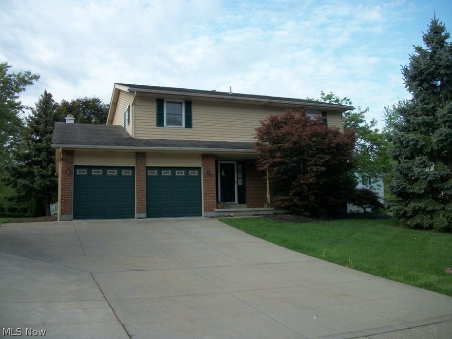 This great 4 bedroom, 2 1/2 bath Colonial is located in Sherwood Acres, & convenient to everything. The welcoming foyer w/ceramic tile opens to the living rm. & adjacent dining rm. w/newer pergo flooring. Kitchen updates incl. Kraftmade cabinetry & pergo flooring. The open kitchen features a nice pantry & convenient built-in desk/work station. A generous casual eating area separates the kitchen & family room. The large family room is complimented by a stone, woodburning fireplace & pergo flooring, w/french doors leading to the covered concrete patio & private backyard for your outside enjoyiment. A desirable master retreat with sitting area, walk-in closet & master bath w/tile flooring awaits you. Three additional bedrooms share another full bath, completing the 2nd floor. The full, unfinished basement has been freshly painted & is ready for your finishing touches or for abundant storage! The 2+ car garage  and extra wide concrete drive helps eliminate car "shuffling" and provides for