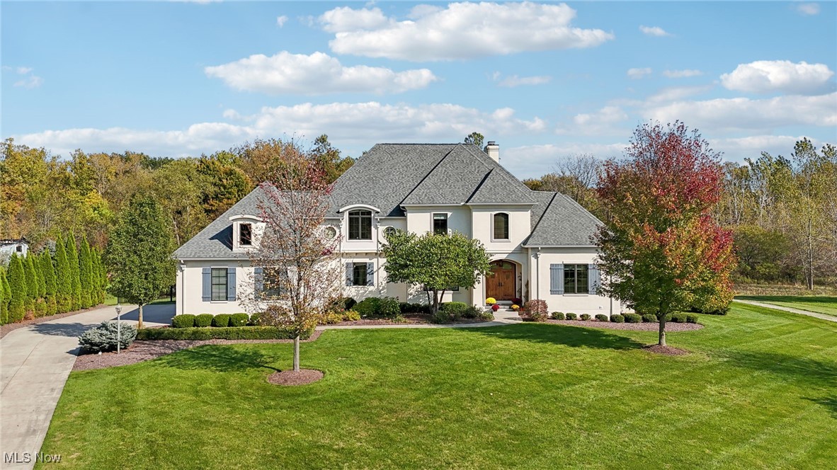 Enjoy character and distinctive features in this bespoke home, situated in the highly sought-after Firestone Trace community in the Revere school district! This close-knit neighborhood offers fun amenities including a pool, tennis courts, and walking trails! The sellers have invested over $70,000 of updates in the last year and intended to live here, but they have had a job change and are moving.
Step into the grand foyer that leads to a formal dining room and a handsome home office with custom built-ins and a private half bath. The spacious living room boasts a dramatic floor-to-ceiling stone fireplace, vaulted ceilings with beautiful wood beams, and an inviting ambiance.
This luxurious chef’s kitchen is equally as gorgeous as it is convenient! There is a large center island, extensive cabinetry, beautiful granite countertops, stainless steel appliances, and an adjoining eating area.
Located right off the kitchen is a welcoming family room, with its sweeping ceilings and fireplace flanked by windows.
The main level also features a mudroom, additional half bath, and a convenient laundry room.
Retreat to the primary suite which showcases a mantled fireplace, vaulted ceilings, and a spa-like, ensuite bathroom that includes double vanities, plenty of storage space, a separate water closet, and a walk-in closet.
Upstairs, find three generous-sized bedrooms - two bedrooms share a jack-and-jill bath, while the third bedroom has its own ensuite.
The finished basement includes a fitness room and media/family room, perfect for relaxation and hanging out!
Outdoor living is made easy in this backyard oasis w/a large screened porch, expansive patio w/stone fireplace and well-maintained hardscape, and a large fenced-in yard that is almost an acre!
The numerous updates include landscaping, fencing, brand-new carpeting, and a new half bathroom! Located in the highly-desirable Revere school district, this gorgeous home has it all!