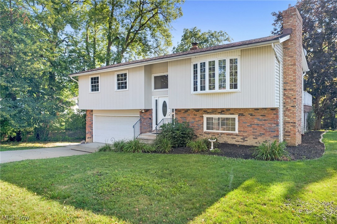Welcome to this bright, fully updated and move-in-ready 3-bedroom, 2-full-bathroom home, tucked on a tree-shaded Brunswick street! A vaulted great room with dramatic exposed beam, warm laminate floors, and a broad picture window sets an airy, welcoming tone. The open dining area flows to a large sun-splashed deck, perfect for entertaining, and the backyard comes fully loaded with the storage shed, trampoline, and grill. The fully updated kitchen with new appliances, cabinets and flooring is accented by a striking brick wall and offers ample cabinetry, prep space, and a handy breakfast ledge. Three comfortable bedrooms with new flooring and an updated full bathroom complete the main level. The finished lower level extends your living space with a family room that is adorned by a stone gas fireplace, second full bath, laundry room, and additional storage areas. Outside you will find a spacious attached 2-car garage and wide driveway. Mature trees throughout the property provide privacy and ample curb appeal. Other notable updates include all new exterior and interior doors, fresh paint, roof tune-up, updated plumbing, new flooring & baseboards, and the deck has been updated and painted. With being minutes to schools, parks, shopping, dining, and I-71, a life of convenience awaits you!