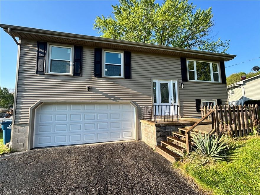 Welcome to this beautifully remodeled 1,520 sq ft home located in a great neighborhood in Hubbard.  Recent updates include a new roof, double-paned windows, vinyl siding, new interior doors and front door, luxury vinyl flooring, new carpet in the bedroom, a new hot water tank, and fresh paint throughout.  The thoughtfully updated interior offers a clean, modern feel with low maintenance finishes and comfortable living spaces.  Conveniently located near local amenities, this move-in-ready home provided an excellent opportunity for homeowners seeking updated features and everyday functionality.  Kitchen has all new cabinets and granite countertops, and comes with brand new refrigerator, stove, over the stove microwave and dishwasher.  Off the top level is a deck to enjoy those summer nights.