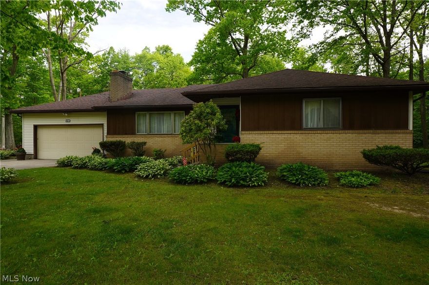 This is it!!  Make no mistake about it.  Located on the end of a dead end street. this ranch home has a lot to offer you.  Spacious living room,  cute kitchen, 3 bedrooms and an updated bath.  Hardwood under the carpeting.  Full basement with another 1/2 bath.  Over an acre lot with a view from the back and side of the house of the woods.  Even comes with a deer feeder and a backyard spotlight.  So nice and serene but also not too far from the conveniences of life and appx 1 hour from Cleveland or Pittusburgh for a weekend get away. Perfect combination.  Call today for your private showing