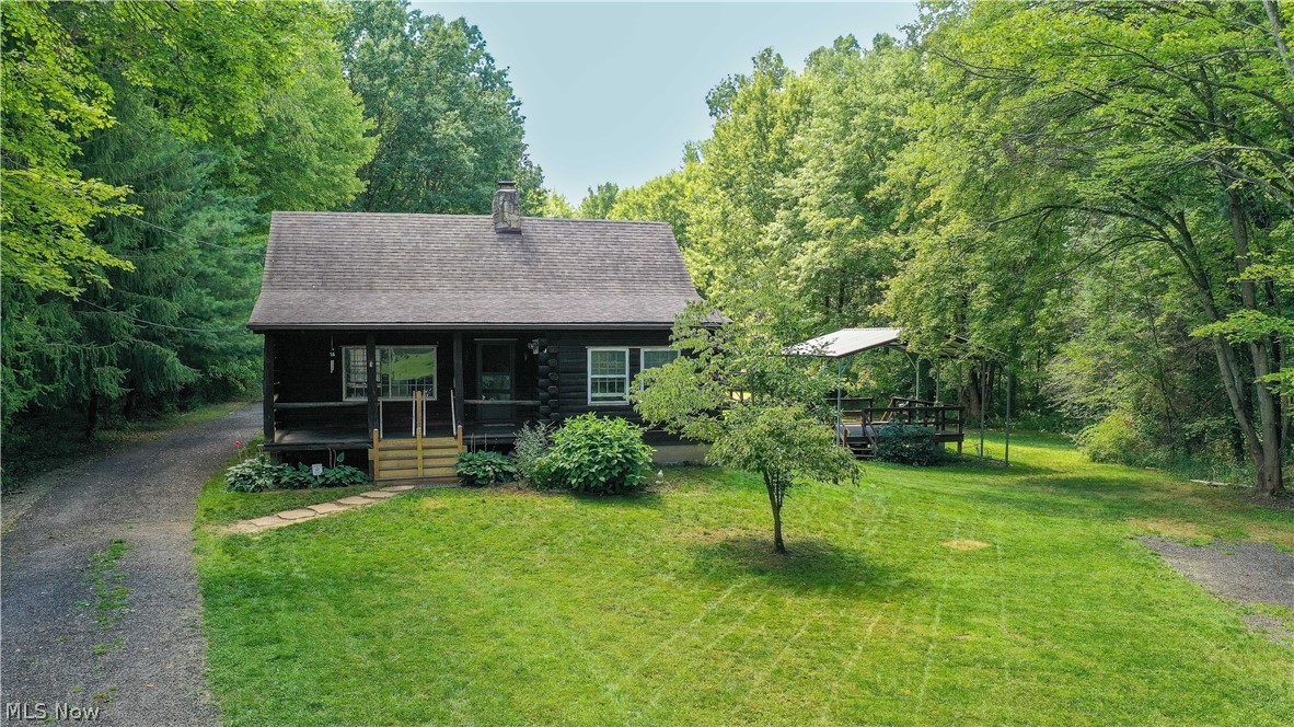 Welcome to this private log cabin home on 9.779 wooded acres. 3 parcels included. The covered front porch is perfect for enjoying the peacefull setting. The spacious living room features a cathedral ceiling and a wood burning stone fireplace. The open kitchen and large dining area have ample space for gatherings. The convenient 1st floor master bedroom and full bath with a jetted tub completes the main level. On the upper level there are 2 bedrooms and a full bath. One is a loft bedroom that overlooks the living room. The enclosed side porch leads to the covered deck, which is a great area for entertaining. The large walkout basement has been waterproofed on the driveway side and has 2 sump pumps, glass block windows, washer and dryer hookups, and lots of storage space. The 1200 sq ft garage has an electric sub panel, room for several vehicles plus additional storage. 25ftx18ft storage shed with overhead door. Updates include a newer roof, 50 gallon hot water tank, gutter guards, boile