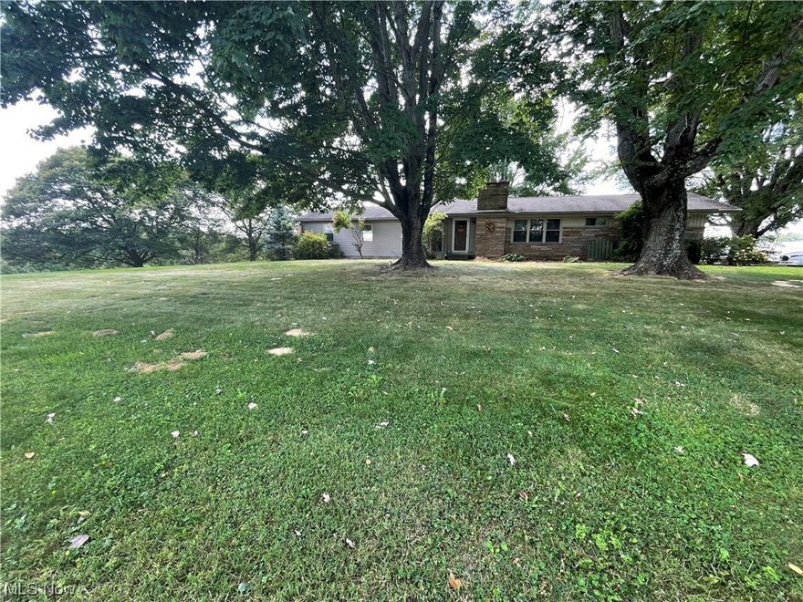 Check out this amazing three-bedroom, two-bathroom ranch home with a full basement, plenty of land, a barn, and an additional garage! It's located just outside of town and has so much more to offer!