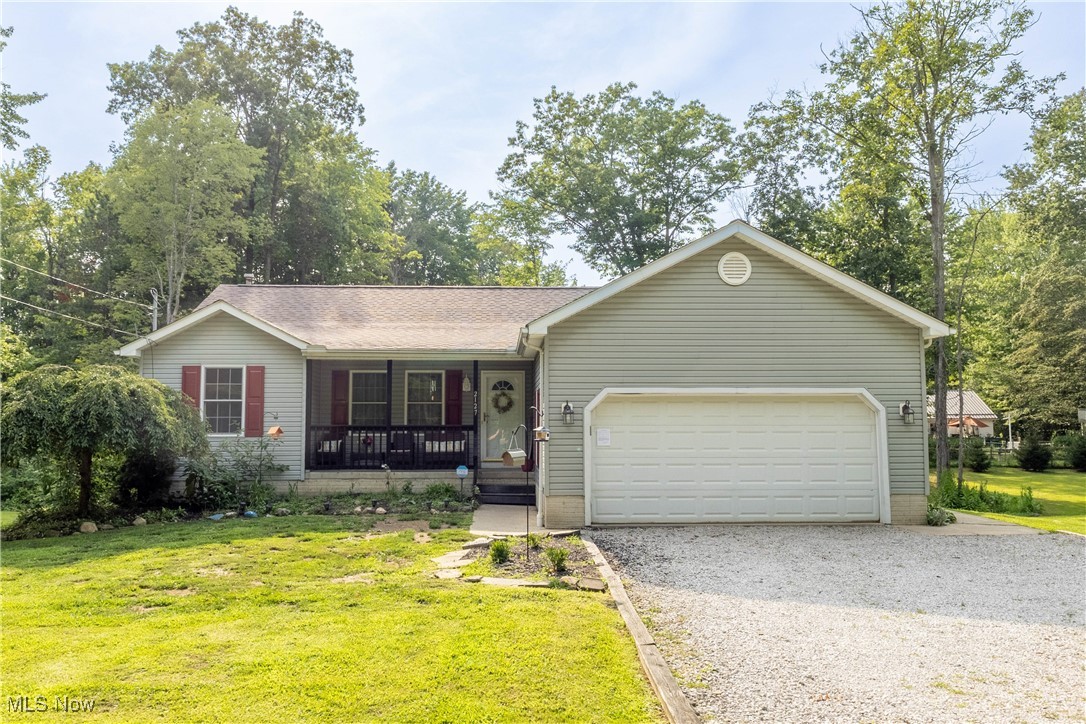 You're going to have to see this to believe it. This spectacular ranch home boasts 3+ bedrooms, 3 full bathrooms and a full, mostly finished, walkout basement. There was an addition added back in 2020 on the back of the home which added a kitchen with granite countertops, quiet-shut drawers and cabinets, center island, 2024 newer fridge and a deck overlooking the backyard. The master suite has enough space for you to never want to leave. The master bathroom includes a jacuzzi tub for the ultimate relaxation after a tough day and the walk in closet which will challenge you to go out and buy more clothes just to fill it; very spacious. Cozy up with a good book in the living room next to the stone gas fireplace or hang out in the lower level rec room in the mostly finished basement. The basement is equipped with a wood stove, 2 finished rooms with flooring, closets, workshop, full bath and mud room which opens up to the expansive 1+ acre backyard. Everything you need to entertain large groups or intimate gatherings is at your fingertips. Newer roof in 2022 with 25 year shingles. A 2 car attached garage, plus a 28x34 detached barn built back in 2018 with two 10x8 overhead doors and a loft. Barn has 11 foot ceilings and electric run to the space. Four lots equaling 1.09 acres becomes your own private oasis. Two of those lots have frontage on Flame Lake (not connected to the main lake). Contact your favorite real estate professional today to schedule your private tour. Roaming Shores is calling....it's time to answer.