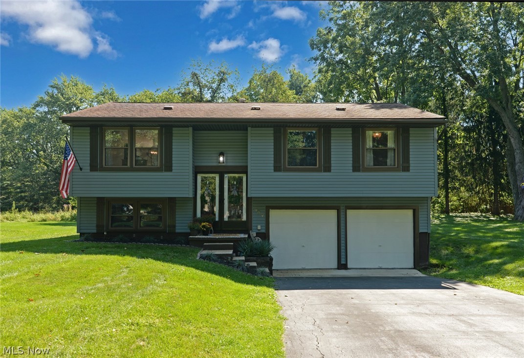 An exceptional Kent bi-level that has been completely remodeled. This 3 bedroom home has an open concept with the kitchen having been opened to the living room and dining room. A large 23x12 family room and half bath are in the lower level. The many updates include the kitchen, baths, flooring, electric panel ('22), furnace ('21), a/c unit ('21), hot water tank ('21), and vinyl siding ('22). Amazing wrought iron style railings, with built in gates, are in the foyer and living room area. A newer composite 2 tier deck is 24x12 main level, with a hot tub ready lower deck as well. A large yard with privacy to the rear, a shed, 2 car garage, and so much more.