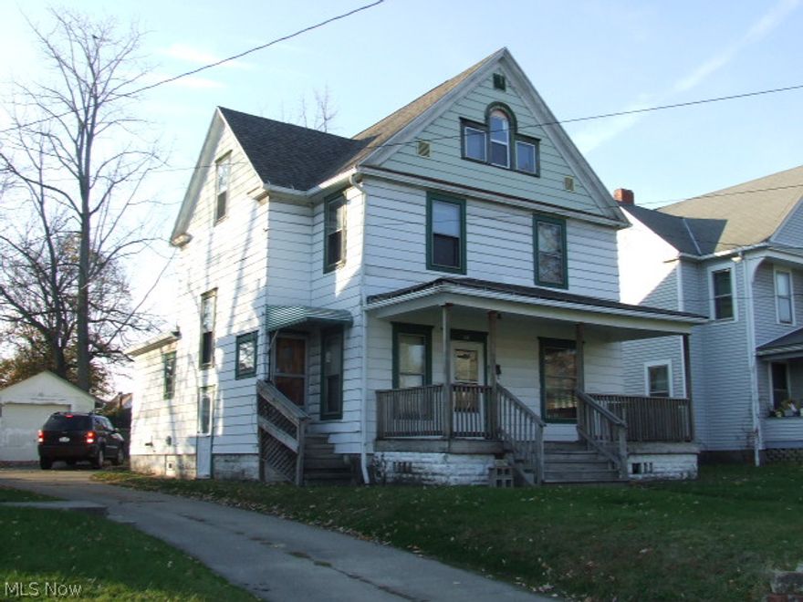 Huge 3-4 bedroom colonial w/different floor plan. 1st floor bull bath, den and formal living and dining rooms. Kitchen has newer countertops, some remodeling started. Beautiful natural wood pocket doors & molding, big closets, finished attic, front porch, large fenced in backyard. Security System. Near St. Anthony's and St. Thomas. Many possibilities. Bring your tools and imagination, needs some Love!