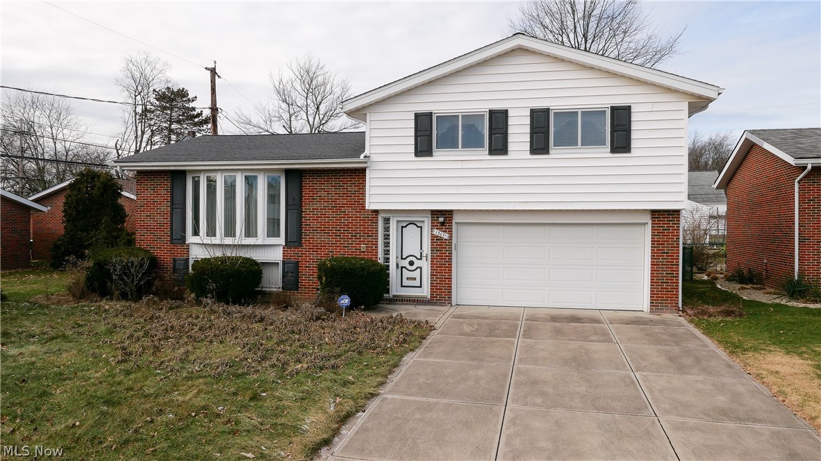 13691 Grove Dr Garfield Heights OH 44125 is a wonderful split level home with 3 bedrooms and full bath on top level and Eat In Kitchen, great size separate Dining Room and HUGE Living Room on the Main Level, Foyer Entry, Coat Closet, Half Bath and Garage Entry at Ground Level and the Lower Level includes the LARGE finished Family Room with Storage Closet and the unfinished area housing the Laundry Room & Mechanicals. Furnace and AC have been updated to high efficient units in great condition as well as roof and includes kitchen appliances. 2 car agarge with ample storage and a door leading to the fenced in rear yard with a covered rear patio for family time or entertaining! The yard was immaculate for years but is presently overgrown & the carpet is still in the Brady Bunch era but otherwise in great condition. The bathrooms could use some updating as well and the upstairs toilet seal has leaked over time and therefore the ceiling below needs repaired. Kitchen faucet and upstairs bath