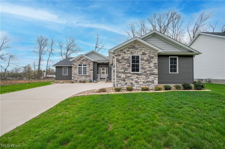 Beautiful and nearly new four bedroom ranch located in the Howland School district.  Only four years young and many additional updates have been added since construction.  This home boast an ideal split floor plan with a generous sized master suite and a stunning master bath that is a room in itself.  The stone shower with heavy glass doors creates a relaxing spa like feel.  The owner has removed the stand alone tub to add a vanity but the plumbing remains for anyone wishing to return a tub of their liking.  The spacious walk-in closet leads to the conveniently located laundry room with additional storage and sink.  The modern and open floor plan features valued ceilings in the great room where an open staircase provides access to the basement for a future finished living space.  With over 2000 square feet of basement the potential is endless for an expansive additional living space that has been plumbed to add a future bathroom.   The kitchen has been upgraded with brand new white Cafe' appliances, a black stone look sink and leathered stone top island. Don't miss the full walk-in pantry with three walls of shelves for all your food storage needs.   All new lighting has been added to the entire house to enhance the already beautiful space.  There is plenty of room for entertaining with a dining nook large enough to seat 8 plus the island can seat up to 4 comfortably.  The back patio has been completely enclosed with windows all around to enjoy the outdoors.  The fully fenced in back yard creates a private respite to enjoy the new concrete patio area and screened in gazebo.  The three car garage provides plenty of room for storage, tools and vehicles.  This is truly a home built with beauty and function.