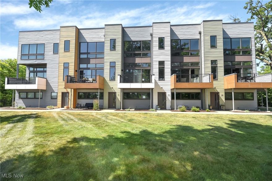 Simply spectacular townhome overlooking the Emerald Valley of Cleveland Metroparks, featuring high end European design and modern custom finishes throughout. Lower level two car garage, den, and foyer. Entering the second level from the open glass staircase, you will find the 10' living room, dining room, kitchen, and 1/2 bath. Third level primary bedroom and en-suite bathroom with glamorous oversized steam shower and soaking tub, and walk-in closet, second bedroom, full bath, and laundry. Fourth level has a gorgeous view and a rooftop kitchen absolutely perfect for summer entertaining! Bamboo flooring is offered throughout with exception of ceramic tile in the full bathrooms. The kitchen countertops are quartz with stainless steel appliances, while the living room is equipped with a wet bar, fireplace and walk out patio. Many floor-to-window ceilings and custom solar shades complete the entire package of low maintenance living. Walking distance to Cleveland Clinic Fairview Hospital, restaurants, shopping, and more!