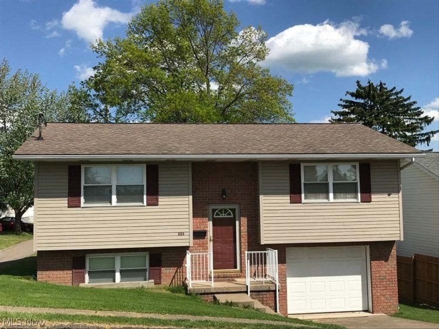 You can move right into this split entry home built in 2001 with two large bedrooms upstairs and an additional two bedrooms in the fully finished lower level (one currently doubling as a laundry room). There's also two full bathrooms, one on each level. You will likely appreciate the open concept in the home's main living area, with a spacious living room leading directly to an eat-in kitchen (appliances included). This home is located on a quiet residential street with a deck off the back leading to nice yard offering off-street parking plus a one-car garage.