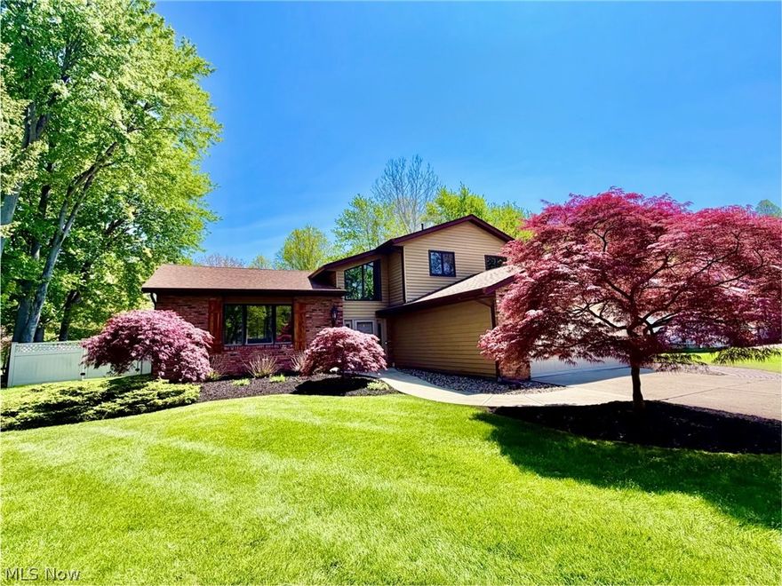 Pristine Split-Level In Quiet Mentor Neighborhood!  This must-see home has calming, neutral decor, high ceilings and wide-open spaces.  The open, two story foyer welcomes you to step up into the living room with vaulted ceilings and loads of natural light.  The formal dining space has sliders to the deck and leads to the spotless, eat-in kitchen with skylights, granite countertops, stainless steel appliances and another set of sliders to the deck.  The kitchen overlooks the oversized family room with a large bay window, built-in bookshelves and a tiled, gas fireplace.  A first floor bedroom/office, a full bath and a laundry space complete the first floor.  Upstairs has a full, hall bath and three generously-sized bedrooms including the owners suite which has a full updated bath.  Out back is an entertainer's paradise with a huge composite deck, a screened in gazebo (with electric), a gas hook up for built in grill, and a landscaped, fire pit area. A shed and a large, scenic yard and a two-car garage with pulldown attic complete this lovely home. Check out the 3D tour.  This amazing home is even better in person!  Call for your showing today!