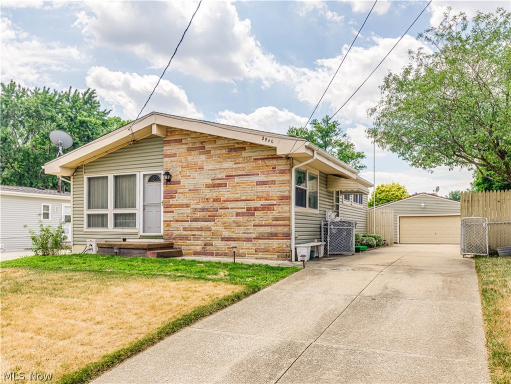 Lots to like in this charming Ranch. Centrally located with easy access to the highway, the first thing you become aware of when you pull up to 2940 Stockton St is the outstanding curb appeal. Vinyl Siding with Stone Accents, a completely fenced yard, 2+ car garage, fantastic cement driveway and a completely fenced yard! Entering the home, you are greeted by vaulted ceilings and a large living room that is open to the kitchen. The 3 bedrooms all have wood flooring under the carpeting as does the living room. The full bath boasts double sinks. Need more room? Wait until you see this basement. A big Rec Room, possible 4th bedroom plus and extra room to use your imagination. There is also a shower stall in the basement for your added convenience. Specific dates are not known, but siding and roof are approx. 10-12yrs, windows were updated but date not known, furnace and C/A are thought to be about midlife. Own this home for less than you would pay in rent! Call for your private show