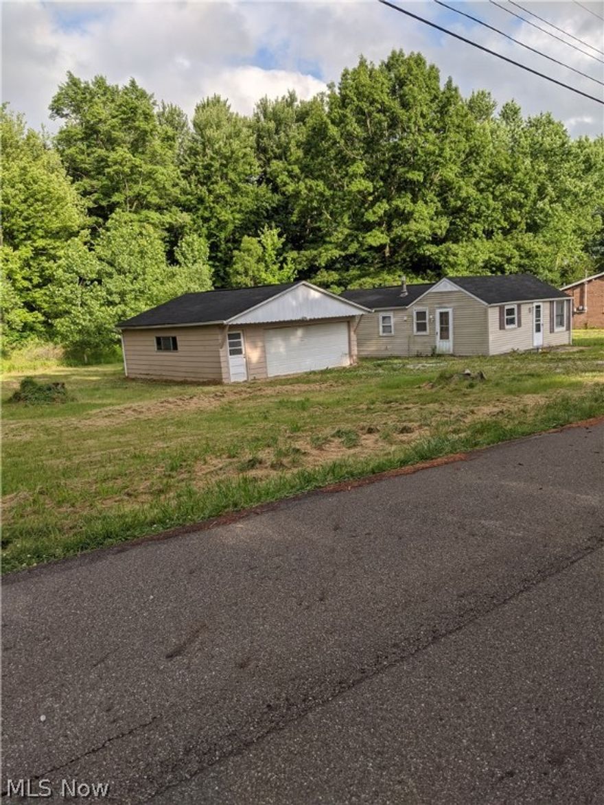 Handy-Man's Bargain! Bring Your Tools and Turn This Place Into An Adorable Ranch, Offers 3 Lots, Oversized Two Car Garage, Woods Behind.
Was 3 Bedroom, Wall Was Torn Out To Make One Bigger Bedroom, Never Completed. Needs A lot Of TLC     CASH ONLY and ALLOW 3 MONTHS For An Acceptance On An Offer.