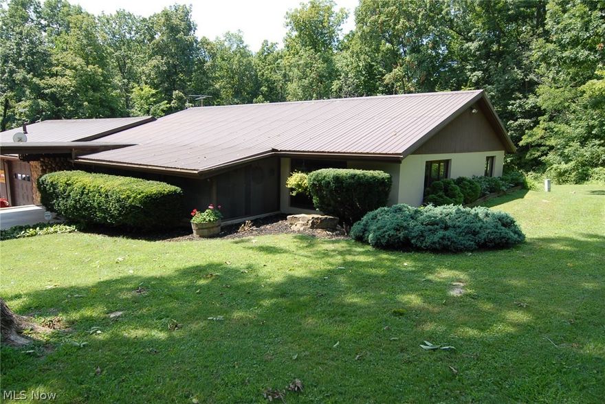 Unique Property zoned commercial / residential 
Quality built 3 (possible 4) bedroom 2 1/2  bath large master suite with fireplace, large walk in closet and sunroom off back  Screened front porch, first floor laundry 
15 garage bays with concrete flooring, drains, electric, heat, MUST SEE