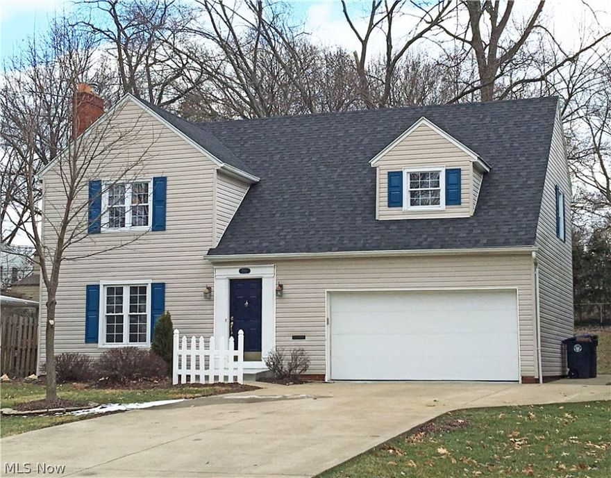 Completely remodeled West Akron charmer on Schneider Park! Prepare to stand amazed at the beautiful hardwood floors that extend throughout the entire home. A wood-burning fireplace highlights the living room, and the adjoining dining area features sliding glass doors to a patio and back door to a covered porch.  Step outside to the newly-built covered porch, fenced-in yard and expansive patio, ready for summer entertaining! Back inside and into the eat-in kitchen, you are going to love the brand new quality Schrock cabinets, high definition countertops, stainless steel appliances, porcelain tile back splash and ceramic tile floor.  The fully remodeled half bath is right around the corner, as is the door to the two-car attached garage with storage space, and bi-fold doors to the dry, unfinished basement and laundry. Back to the living room, an original Art Deco stair rail frames the steps to the second floor, where those amazing wood floors just go on and on. The second floor boasts fou