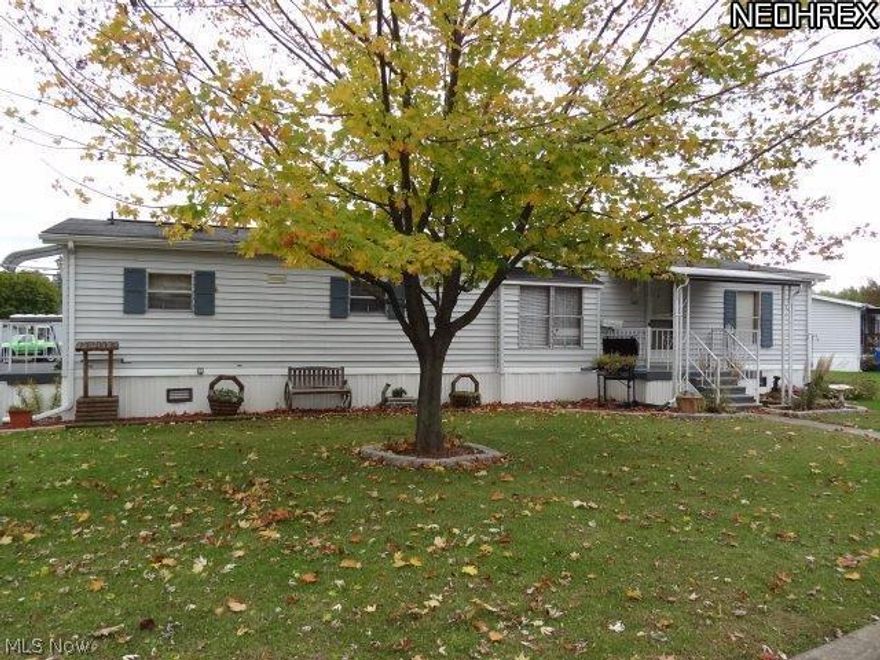 Beautiful Doublewide with Vaulted Ceiling, open concept living and dining room 18 x 25.  Very well maintained and spotless 3 bedroom, 2 bath mobile home.  Master bedroom with large master bath soaking tub, double vanities, large closed, updated bath with 3 x 3 shower and newer flooring.  Very large nice kitchen with newer flooring.  Refrigerator does not stay.  Hot water tank 4 years old.  8 x 12 shed with newer vinyl siding, very nice.  Rear deck and front porch.  Carport for 1 car in front of shed.  Home has a large corner lot with a beautiful shade tree in front lawn.  Well landscaped all around home.  Lot lease is $250 per month.  1988 Bridgeport. Current owner pays no taxes because of a homestead exemption.  If new owner does not qualify, the taxes will be $108.83 per half.