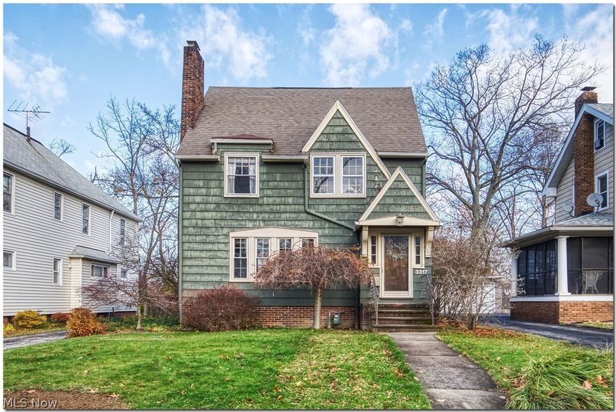 Welcome to one of the friendliest streets in Cleveland Heights!  Starting with the front door, you will fall in love with the character of this classic home in the beloved Cedar-Lee neighborhood!  Charming architectural details, stunning woodwork and hardwood floors, unique full height built-in cabinet, french doors out to the fabulous porch, and a classic mantel over the wood burning fireplace.  Great flow from the living and dining rooms; perfect for entertaining.  Generous eat-in kitchen with updated cabinetry.  Of course, there is a cute little powder room too.  On the 2nd floor, there is a spacious main bedroom, 2 other bedrooms and a full bath with its original charm. The finished third floor is the perfect bonus space for an additional bedroom, guests,  home office, or family room.  Enjoy the outdoors on the second floor balcony, huge back porch or in the fully fenced yard.  Washer and dryer (2020).  New asphalt driveway (December 2021).  This home is a  fantastic opportunity to
