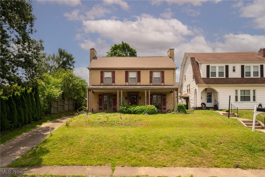 This isn’t just a house—it’s a home with a story. Thoughtfully renovated in 2022, this classic brick colonial blends century-home charm with tasteful modern updates in all the right places.
Step into a light-filled living room anchored by a stunning wood-burning fireplace (now with a gas insert). Rich, refinished hardwood floors carry throughout the home, adding warmth and authenticity at every turn.
The updated kitchen keeps its soul, featuring custom wood cabinetry, updated countertops, and a full suite of stainless steel appliances. Entertain in the formal dining room, or enjoy peaceful mornings and laid-back evenings on the expansive covered front porch—accessible through dual French doors from both the living and dining rooms.
Upstairs, you’ll find generously sized bedrooms, including a primary suite that boasts its own fireplace, a rare and cozy touch.
Major updates include a brand-new forced air furnace and roof in 2025, a 200-amp electric panel, and replacement windows throughout. The 2-car detached garage provides added convenience and storage, while the deep backyard offers space to play, garden, or just enjoy.`