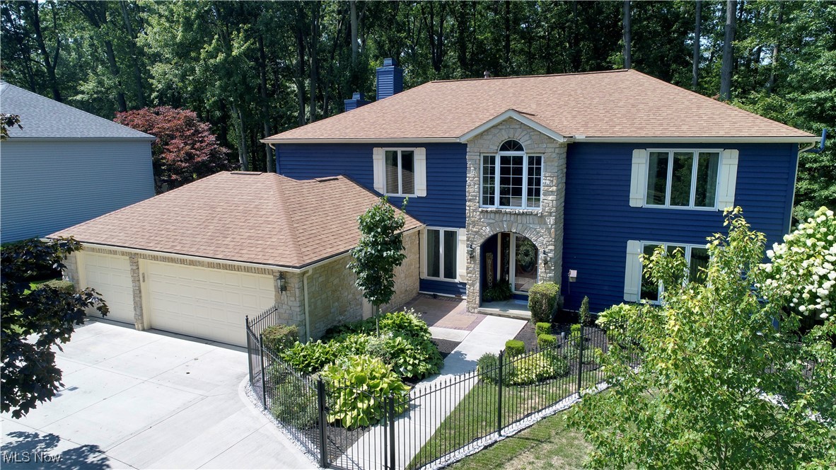 Gorgeous Colonial in Westlake just waiting for it's new owners! As you enter into the neighborhood, you'll love the beautiful tree-lined streets with sidewalks throughout. A large circular drive welcomes you as you pull up to your 3-car garage. Through the gate, you'll find a large front patio area and expansive stone entryway. Enter into your grand foyer with recessed lighting and large chandelier with gleaming marble floors that carry into the main area. Off of the foyer, step into the living room with large picture window which flows seamlessly into the dining room and kitchen. This top of the line eat-in kitchen is a dream with an island, Quartzite counter-tops, new white cabinet's and updated appliances including a smart Samsung refrigerator, dishwasher, Viking range and microwave! Step down to your bright and cozy family room with gas fireplace, a wet bar and built-in shelving with tons of natural light. Rounding out the 1st level is an office, an updated half bath, and a laundry/mudroom area off of the garage. The garage has been insulated and has extra storage above. Upstairs you'll be amazed at the expansive master bedroom and bath with a see through gas fireplace, soaker tub and smart light/speaker system in shower. There are 3 additional bedrooms, a full guest bath, and another ensuite bath on the 2nd floor! The finished basement has lifetime warranted naturestone flooring and another full bath! Last but not least, relax or entertain on your two-tiered deck overlooking your fully fenced and wooded backyard. You'll have peace of mind knowing seller spared no expense since 2021 with updates including new flooring throughout most of the home, high efficiency furnace with smart thermostat and WIFI control, new electric panel, new whole house Generac Generator, smart sprinkler system, French drains installed in side and backyard, exterior of home and deck recently repainted. Roof & gutters were replaced in 2022 and have transferrable warranty. Welcome Home!