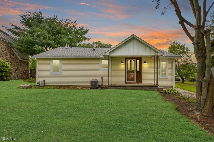 Welcome to this adorable ranch seconds from Portage Lakes in Coventry LSD! Walk up to the home and walk into the front door with a large living room with nice lighting and vaulted ceilings! Walk into the kitchen area where freshly made serving window with all appliances to stay, walk into the dining room with new flooring nice natural light with the back sliding glass door and the side entry door! Come back through the kitchen and there is a kitchen bar seating with the bar stools to stay! Enter into the first bedroom off to the left, come back to hallway and you will have the nicely sized fully remodeled main bathroom, then down the hall is the master bedroom with built in cabinets throughout and a half remodeled bathroom! Enter back through and go to basement and see a finished space to enjoy and your utilities on the other unfinished side! Come back upstairs and through the back sliding door and enjoy your brand new concrete patio, retaining wall and nice trek decking! Nice sized ba