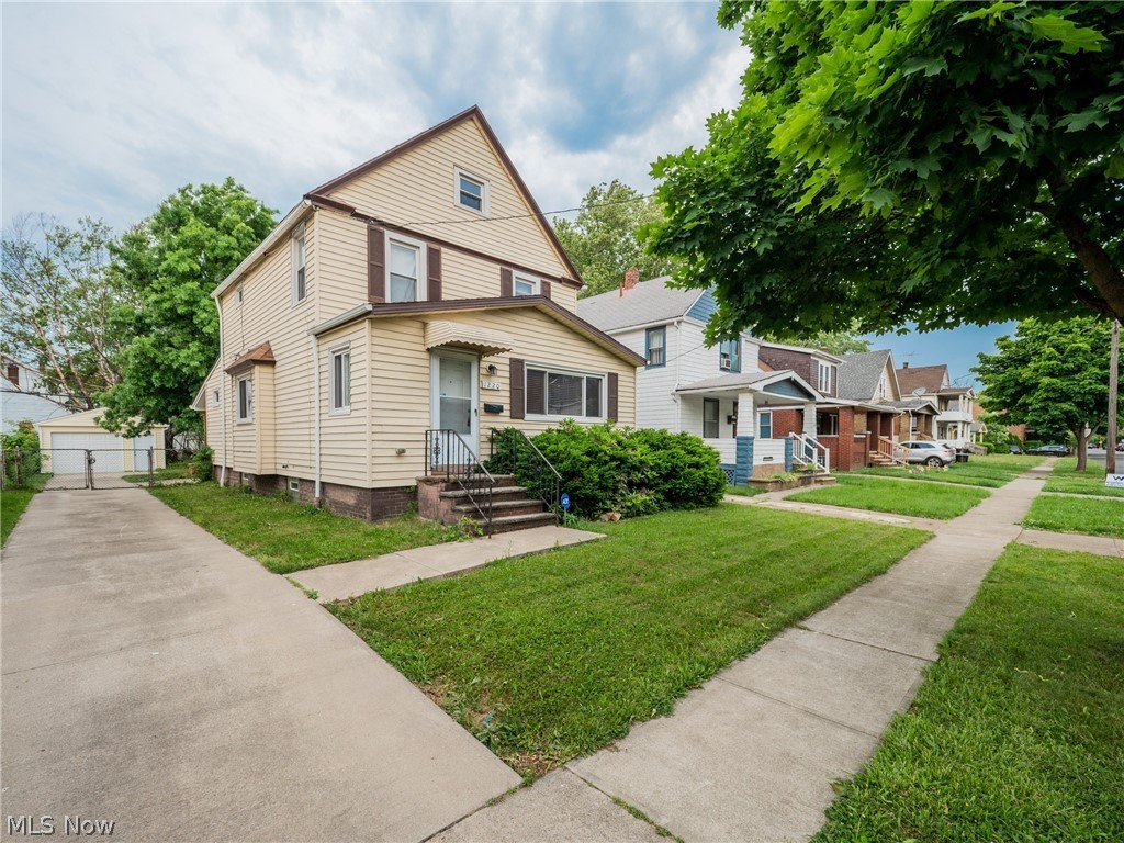 Great opportunity for a charming colonial on a tree-lined street in Cleveland! This lovely home features 3 bedrooms, 1 bathroom, spacious open living areas, and a fully fenced back yard. The front door opens into a welcoming living room that flows into the formal dining room. Here you will find carpeting and large windows that fill the room with sunlight. The dining room connects to the large, open kitchen that includes a full complement of appliances, plenty of cabinet and counter space, and a lovely eat-in area. A laundry room and a half bath down the hallway complete the first floor. Upstairs, there are three bedrooms, all with neutral paint and carpeting. A large full bathroom that completes the second floor. The lower level provides ample space for storage. Outside, there is a lovely back deck and an oversized 1-car garage. Located in North Collinwood just minutes away from schools, parks, highway access, and the popular Waterloo Arts District. Don't miss this one!