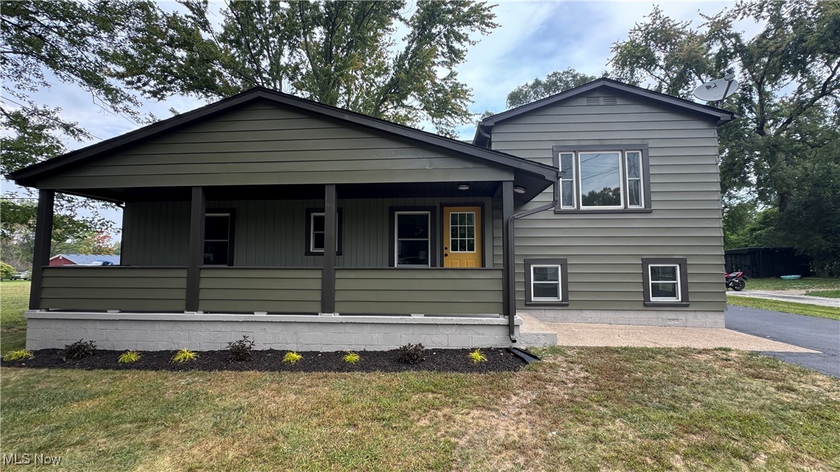 This one is move-in ready and a must-see! Just minutes from the Mentor Nature Preserve, this completely remodeled 3-bedroom, 2-bath home offers modern updates and charm throughout. Featuring an expansive (32x24) 2-car garage with room for cars, workshop area or recreational toys and a fully fenced backyard. The property has been upgraded with a new septic, furnace, A/C, and water heater (2025), updated electric panels, a dry basement with sump pump and backup pump provide peace of mind. The spacious primary suite includes a fully renovated ensuite with a tiled shower, luxury vinyl tile, and all-new fixtures. Fresh flooring flows throughout the home with a mix of LVT and carpet, complemented by fresh paint.
The brand-new kitchen shines with quartz countertops, tile backsplash, stainless steel stove, dishwasher, microwave, and a bright eat-in area. Both the living room and family room feature luxury vinyl tile for durability and style.
A full basement with laundry adds bonus storage space. Outdoors, enjoy a large new back deck, additional concrete patio, and a big covered front porch—perfect for relaxing or entertaining.
