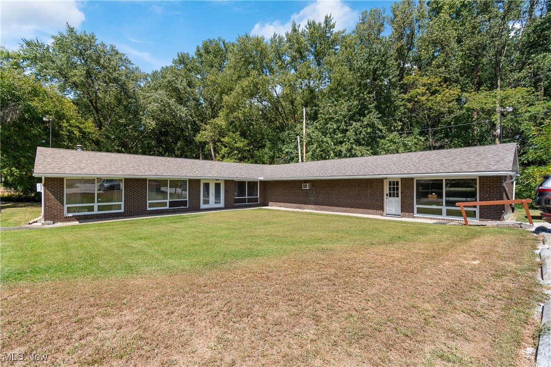 Commercial Opportunity! A Well maintained Brick building with over 2,600 sq ft and two separate suites located in Franklin Township just North of Canal Fulton. Grow your business and lease opportunities on Manchester Road(Rt 93) just off Akron Road (State Route 236), providing excellent visibility and convenient access. Currently leased with double entries suitable for multiuse businesses. Included is a kitchen area with cabinets. Additional features include handicap ramp access, two bathrooms, utility areas, A/C wall units, hot water steam heat, and ceiling fans. Interior layout offers large open work areas with separation as needed. Roof is approximately 4 years old and the property has been well maintained with records available upon request. Plenty of parking, including garage/storage space. Two parcels convey with purchase.