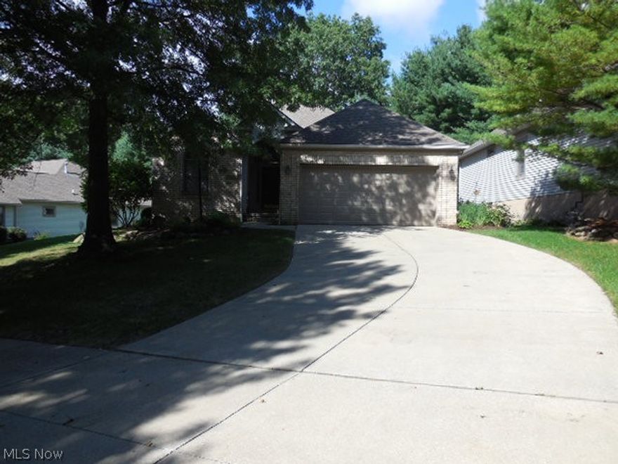 You'll be sold the instant you enter into this beautiful Condo/ cluster home
 that offers a contemporary flair with a very open floor plan. The great room is designed to show your furnishings to it's best advantage as you warm up in front of the beautiful brick gas log fireplace. The cherry dining area makes meal time a happy occasion while enjoying the view through the picture window as you dine. Meal preparation is a breeze in this updated ultra modern kitchen, which offers newer soft close cabinets, granite counter tops and back splash along with newer appliance and storage galore. We are sure you will be pleased with size of the master bedroom with an updated bathroom and a wonderful walk-in closet that will keep you organized. A full bath is within steps of the  guest bedroom and office. Enter the four season / sun room which offers heat c/a as well as a wonderful view of the deck and private wooded back yard. Updates include manufactured hardwood floors through out, Skylights (2