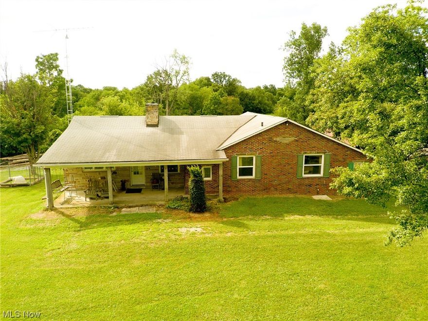Property to be sold at auction: August 26th 11:00AM. 22 acres with a 3-bedroom, 2-bath brick ranch home. The house offers an attached 2-car garage, walk-out basement, and a deck that offers an expansive view of the scenic countryside. Inside, you'll find a well-appointed kitchen with tile flooring and hardwood cabinets, a dining room, a sunroom that opens onto the deck, a living room featuring a cozy wood fireplace, and 3 bedrooms. The basement houses a spacious family room warmed by a wood-burning stove. The home is heated by a Natural Gas forced air furnace and a NG hot water boiler.
Also included are several outbuildings: a heated 28' x 40' workshop, a 28'x56' machinery pole barn, and other additional buildings. Towards the rear, you'll find a flat hay field perfect for agricultural use. Don't miss out on this unique opportunity to acquire a tranquil rural property or an excellent addition to your land holdings, all at an absolute auction without reserve.