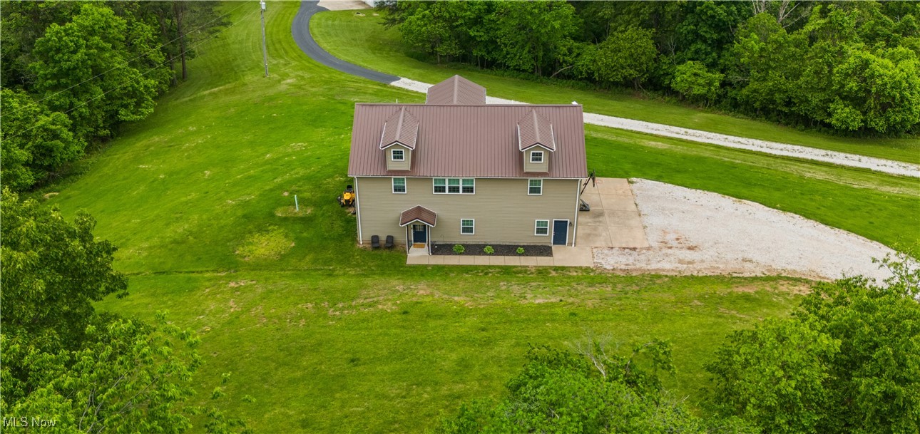 ****THE PROTECTION OF A ONE-YEAR Home Warranty Included! **** MOTIVATED SELLERS!! Escape the everyday hustle and come home to the tranquility of country living. This beautiful home, built in 2012, offers modern living with the perfect amount of privacy. Sitting on nearly 2 acres, this 3-bedroom, 4-bath house has so much to offer! Pulling into the gravel driveway, you will find a 2-stall oversized attached garage (31x31) waiting to be filled with plenty of outdoor toys and hobbies. Entering the lower level of the home will be a half bath and a family room with ample floor space, perfect for entertaining or relaxing. Walking upstairs onto the warm hardwood floors is the living room with an open feel flowing right into the dining room and kitchen. The French doors just off the dining room lead outside to the deck. Perfectly placed for easy filling access! Below the deck is a concrete patio with a warm and bubbly hot tub. The upstairs has 3 bedrooms, which include the roomy master suite. The remaining 2 bedrooms share a Jack and Jill bathroom. Don't forget there is a half bath on each level for any of the guests' needs. Each bedroom has its own spacious walk-in closet with organizing shelves! Don't miss this opportunity to own a newer home outside of town. Ready and waiting for you to make the outdoor space and all-season paradise!