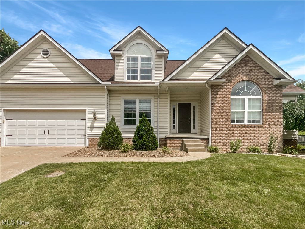 Check out this gorgeous 4 bedroom home in the desirable Mystic Pointe community! Take note of the unique features this home offers: custom kitchen finishes and stainless appliances, a first floor primary suite, wood flooring, and a two story great room with stunning natural light. Throughout the home you'll enjoy neutral finishes and designer lighting.There are three additional bedrooms, plus a full bath, on the second floor. Don't miss the basement with plenty of room to suit your needs. The large backyard is fenced for privacy and enjoyment. The deck area makes a great spot for BBQs! Hurry, this won’t last long!. 100-Day Home Warranty coverage available at closing