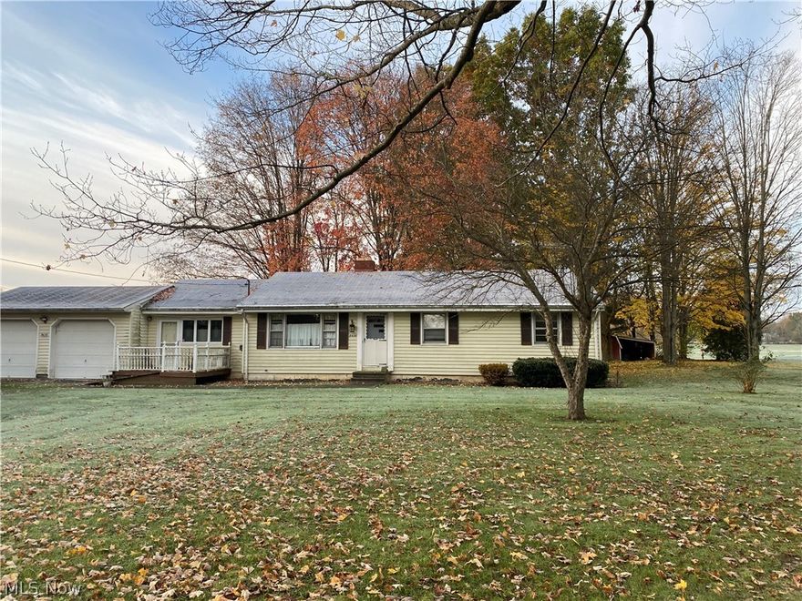 Priced to Sell!! Great Starter home or rental property! Front door enters into a family room area that was once a single car garage. Eat in kitchen with patio doors that open up onto a deck area over looking a nice size backyard.  The back bedroom was turned into a laundry area and can be easily reverted back into a bedroom.  There are well taken care of hardwood floors through out the home.   Basement has high ceilings and lots of storage area.  Spacious 2 car garage that sits on almost an acre.