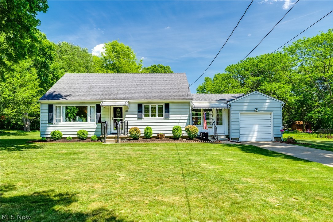 Welcome home! Wonderfully maintained 3BD/1.5BA cape in fantastic Kent location near Longcoy Elementary, Fred Fuller Park, Portage Hike and Bike Trail, Route 59 and Stow-Kent shopping, and just minutes to KSU! Situated on a large freshly landscaped .5+ acre lot, this bright home features many thoughtful updates including newer entry and interior doors, carpeting in both main-level bedrooms and the living room (hardwoods underneath), and neutral paint. The cheerful eat-in kitchen boasts newer stainless appliances (range, dishwasher, and fridge), luxury vinyl plank flooring, and granite countertops. The main bathroom has been completely renovated with a newer shower/tub, vinyl flooring, and vanity. Upstairs, enjoy a spacious primary bedroom with beautiful hardwood floors, seating nook, and plentiful closet space. Downstairs is an additional 300+ finished sq footage that includes a recreation room and bonus room, as well as a convenient 1/2 bath with newer vinyl flooring, vanity, and toile