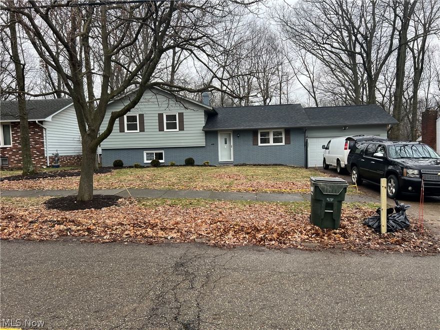 Fully renovated split level home in Bedford with wood burning fireplace. Home has a new roof, new windows, new engineered hardwood flooring from Sheoga on the first and lower level. New high efficiency furnace. New exterior and interior doors. New insulated garage door. New kitchen with granite countertops, new cabinets. New bathrooms, with the main bathroom featuring a whirlpool bathtub. The house has recessed lighting throughout, all have the nightlight feature. New kitchen appliances (oven, dishwasher, microwave, refrigerator, new disposal, new dishwasher. Kitchen also has an above the range hood exhaust fan. Both bathrooms are wired for and feature bidets seats. The garage has a new side mounted garage door opener and features recessed lighting. Home also features ceiling fans in each of the bedrooms as well as in the kitchen and dining area. Beautiful views at the rear of the house. PLEASE USE SUPPLIED FOOTIES OR TAKE SHOES OFF. PLEASE NO CHILDREN ALLOWED DURING SHOWING! NO PETS PLEASE.