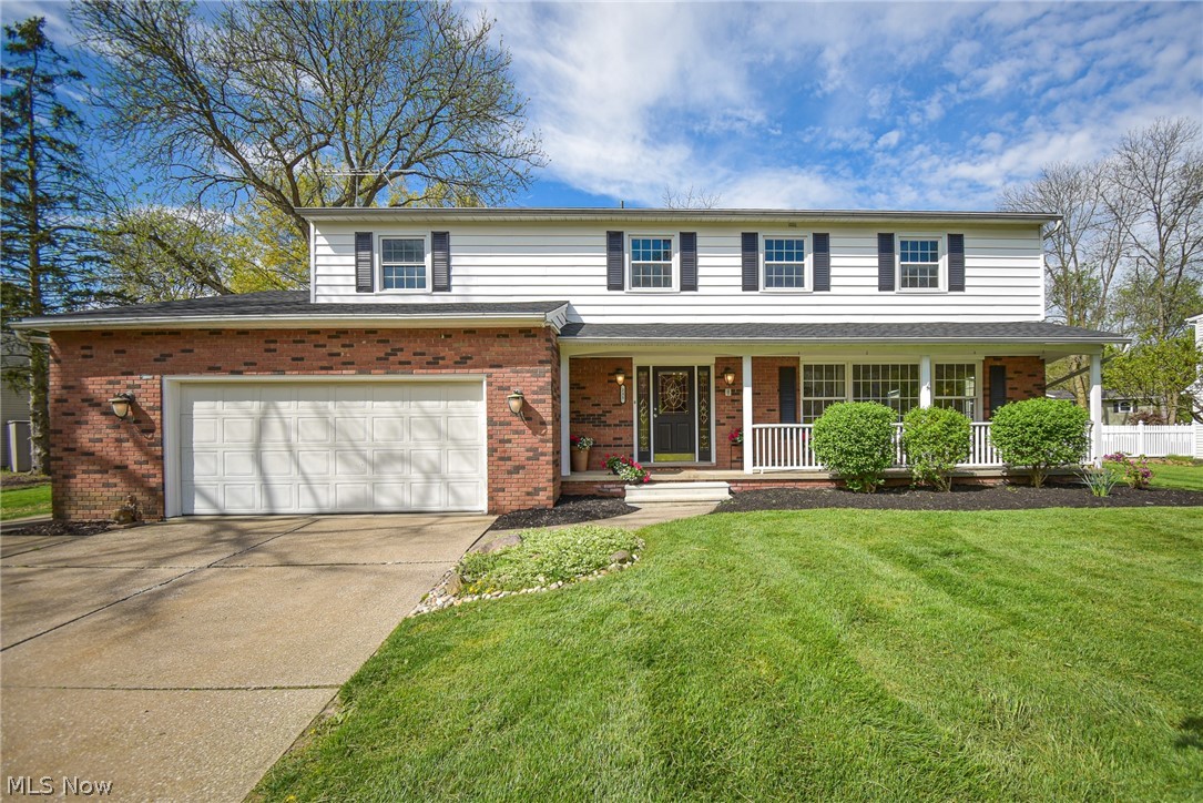 Welcome to this spacious 5-bedroom, 4-bathroom (2 full/2 half) colonial home featuring an attached oversized 2-car garage and a secluded backyard oasis. The grand front porch invites you to unwind, offering a perfect spot for enjoying your favorite beverage. Upon entering, the formal foyer leads to the sunlit living room on the right, boasting beautiful hardwood floors and a partially open staircase to the left. The adjacent formal dining room continues the hardwood flooring theme, creating a seamless flow throughout. The eat-in kitchen is spacious and practical, equipped with ample cabinet and countertop space, luxury vinyl plank flooring, access to the back patio, and a delightful view of the family room. Gather around the wood-burning fireplace in the family room, creating cozy memories on chilly evenings. A sliding glass door seamlessly connects the indoors with the outdoor patio and yard space. Completing the main level is a convenient half bath for guests. Upstairs, discover the sizeable primary suite with a walk-in closet and a private bath. Additionally, there are four generously sized bedrooms, all with great closet space and a guest bath featuring a dual sink vanity, ensuring comfort for everyone. The lower level boasts a fantastic rec room, perfect for entertaining, hobbies, or a playroom, along with storage space, a half bath, and a reinforced wall with a transferrable warranty for peace of mind. Step outside to the expansive, park-like backyard with a wood privacy fence encompassing most of the yard, offering a serene retreat for all seasons. The large covered patio space is ideal for grilling and hosting gatherings with loved ones. Additional updates include newer windows and a brand-new roof (Oct 2023). Conveniently located near the rec center, schools, medical center, and the historic Medina Square, this home offers spacious living and endless possibilities. Don't miss the opportunity to make this exceptional property your new haven!